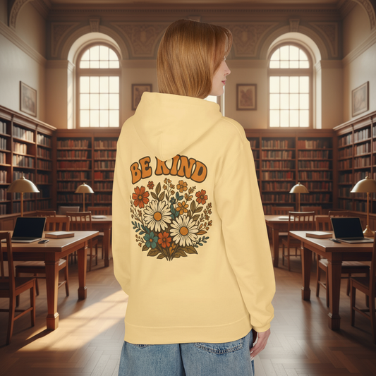 Woman wearing BE KIND hoodie in college library