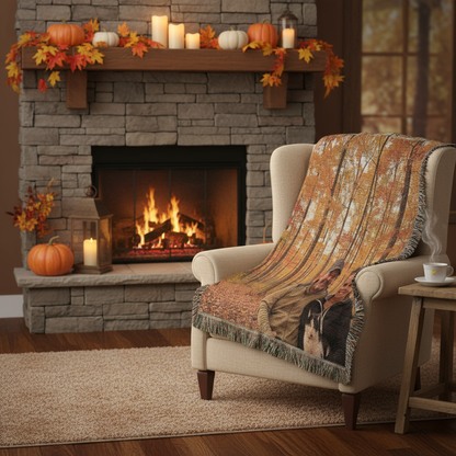 Woven blanket draped over armchair by fireplace
